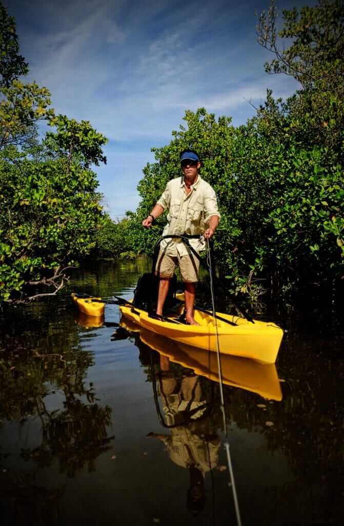 Man standing on a Fishing Kayak
