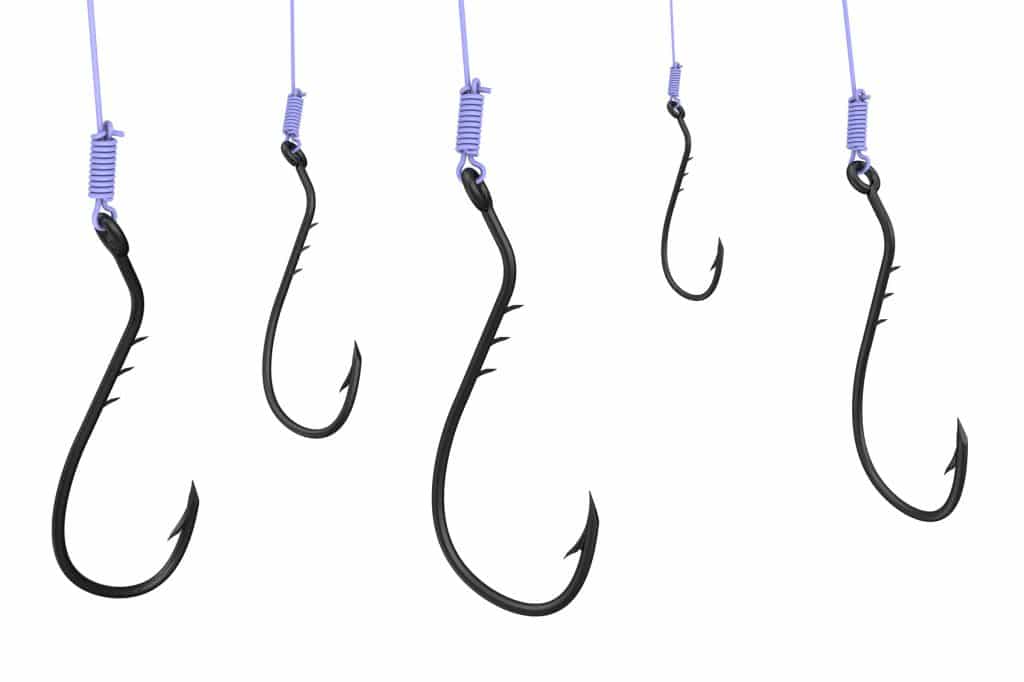 Fishing hooks on the fishing line. The three-dimensional illustration. Isolated