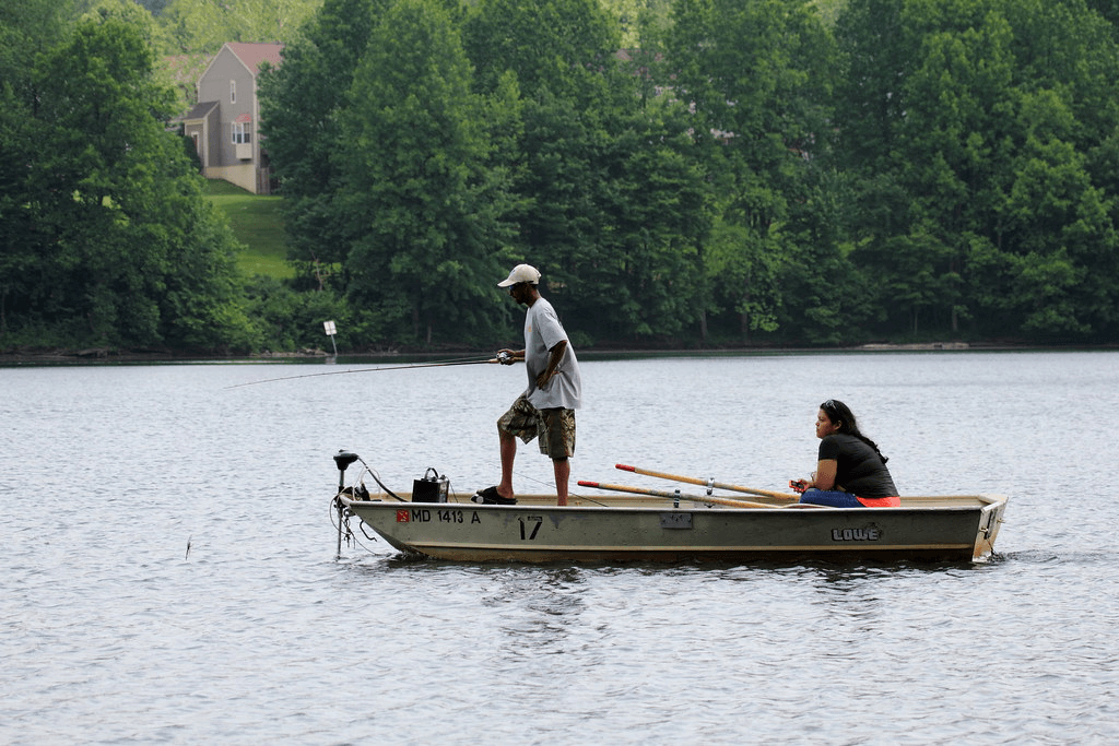 Man with woman fishing in the boat