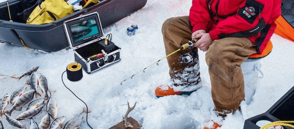 Fisherman fishing with the help of an ice fishing camera