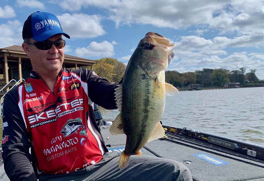 Jay Yelas catching bass fish