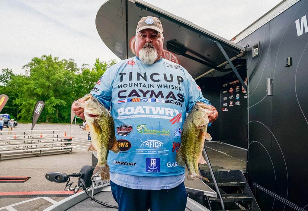 Dion Hibdon with his bass fishes catch