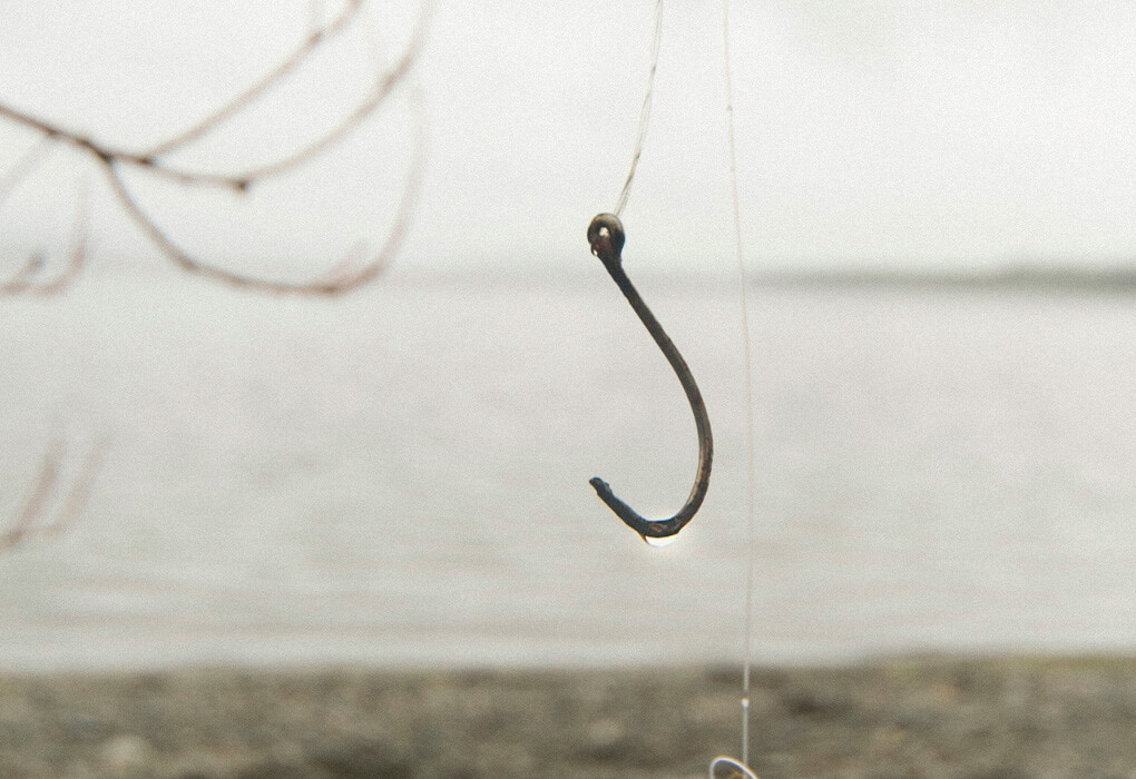 fishing hook on a fishing line - how to spool a baitcaster