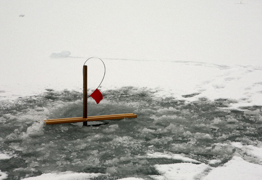 ice fishing tip up with a red flag