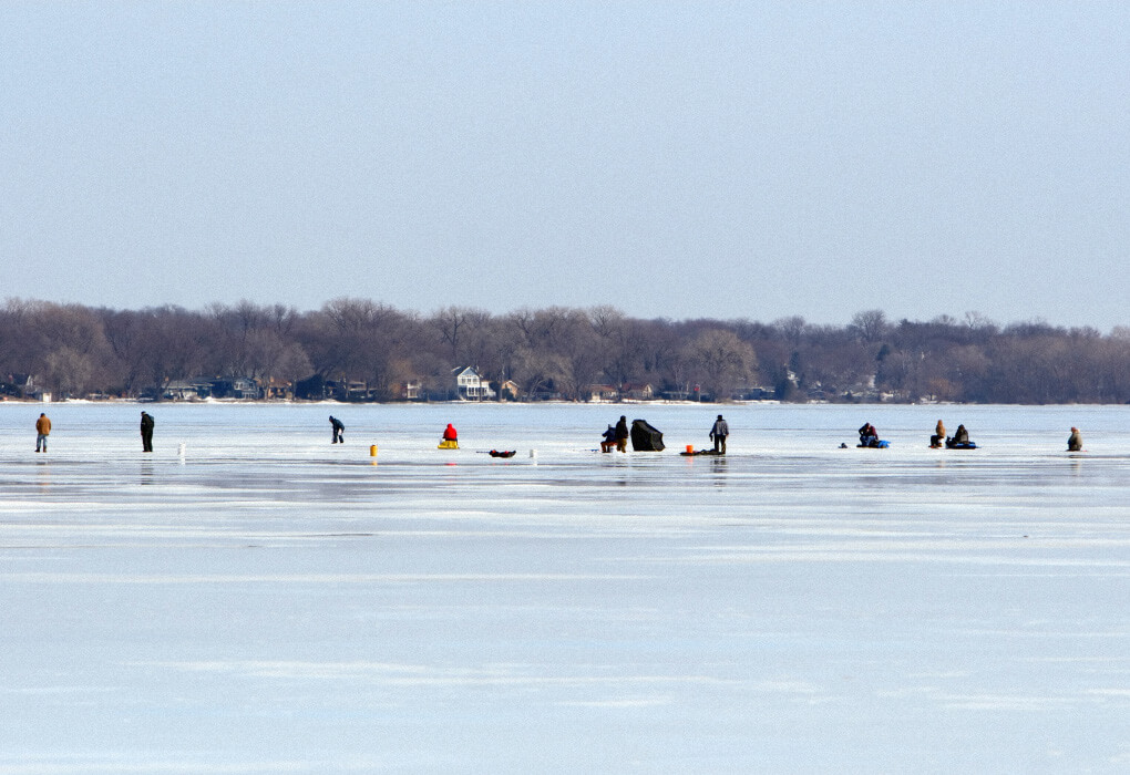 group of people ice fishing
