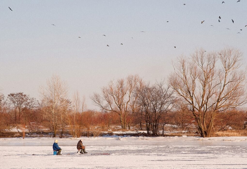 fishermen on a frozen lake gone bass fishing