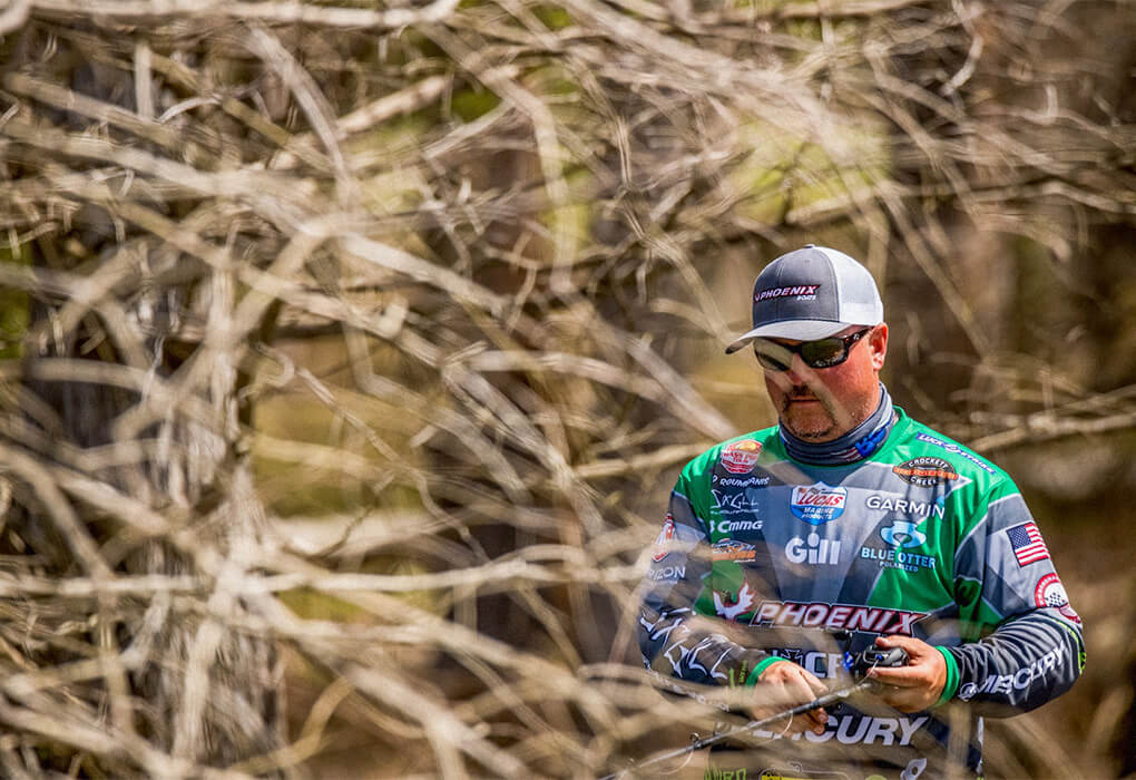 Fred Roumbanis often works thick cover in the shallows to catch hiding bass (photo by Phoenix Moore/Major League Fishing)