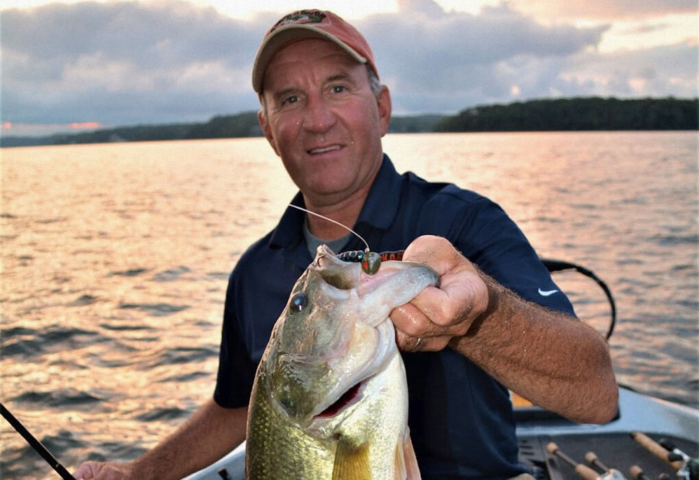 Jim Dill, a longtime guide on Lake of the Ozarks, knows there are some big bass hiding at the edges of all that activity (photo by Brent Frazee)