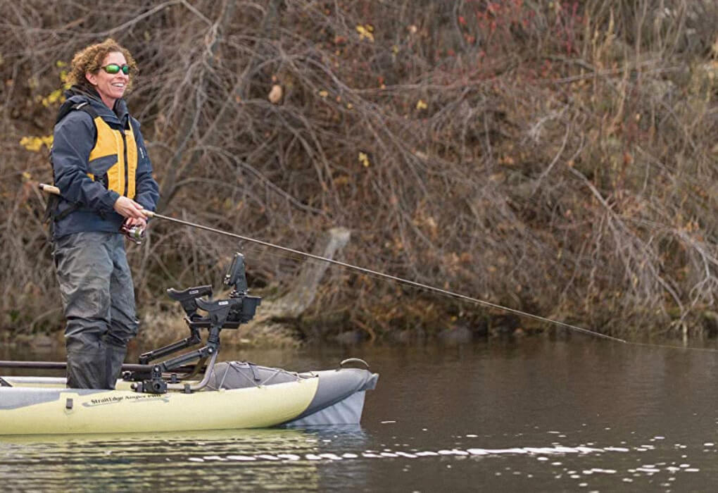 lady fishing with a kayak fishing rod from a inflatable kayak