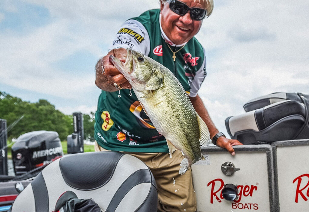 Jimmy Houston showed off one of the bass he caught during an FLW tournament (photo by Charles Waldorf/Major League Fishing)