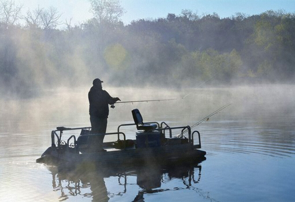 man fishing out on water