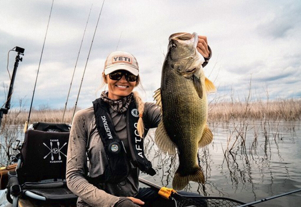Kristine Fischer uses her Hobie kayak to sneak up on some giant bass. (photo courtesy of Kristine Fischer)