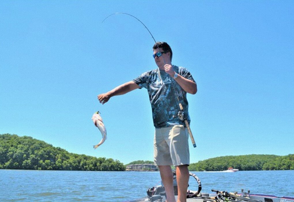 Marcus Sykora knows that isolated brush piles can hold bass in the heat of summer. (Photo by Brent Frazee)