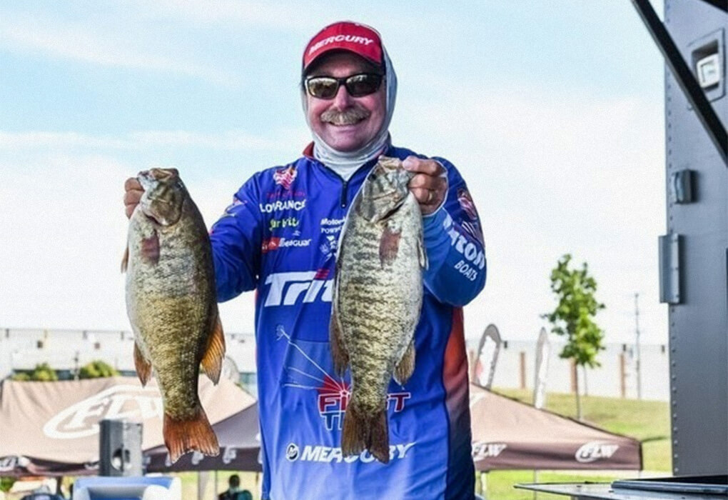 Bass fishing fans are accustomed to this scene--a smiling Shaw Grigsby displaying big bass. (Photo by Charles Waldorf/Major League Fishing)