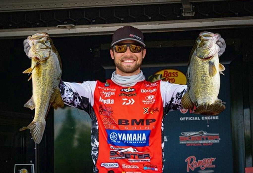 Brandon Palaniuk showed off two of the bass he used to win a Bassmaster Open tournament on the James River in Virginia. (Photo by Brenden Kanies/B.A.S.S.)