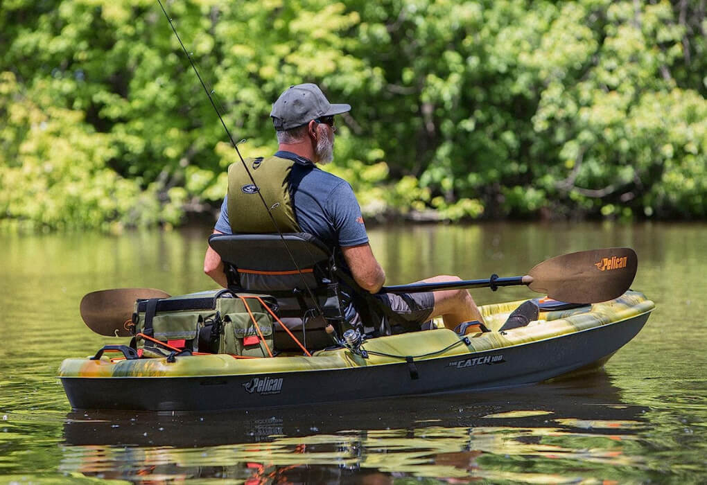 fisherman out on water, paddling from fishing kayak