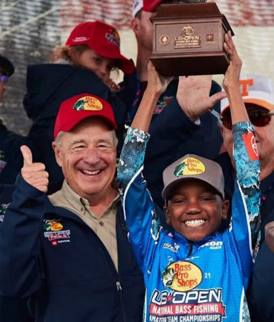 Bass Pro Shops legend Johnny Morris and Ke'Mari Cooper shared a moment after Cooper won the youth division of the U.S. Open that Morris sponsored. (Photo by Bass Pro Shops)