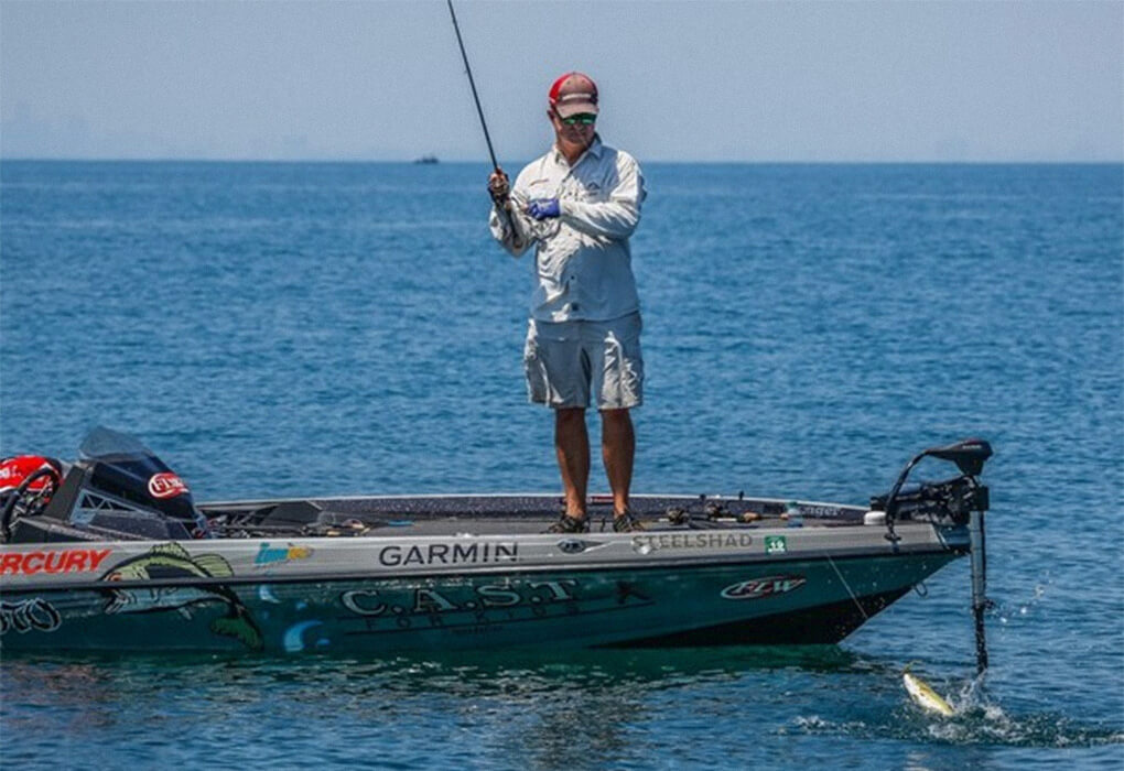 Jay Yelas reeled in a bass while competing on the FLW Tour. (Photo by Sean Ostruszka/Major League Fishing)