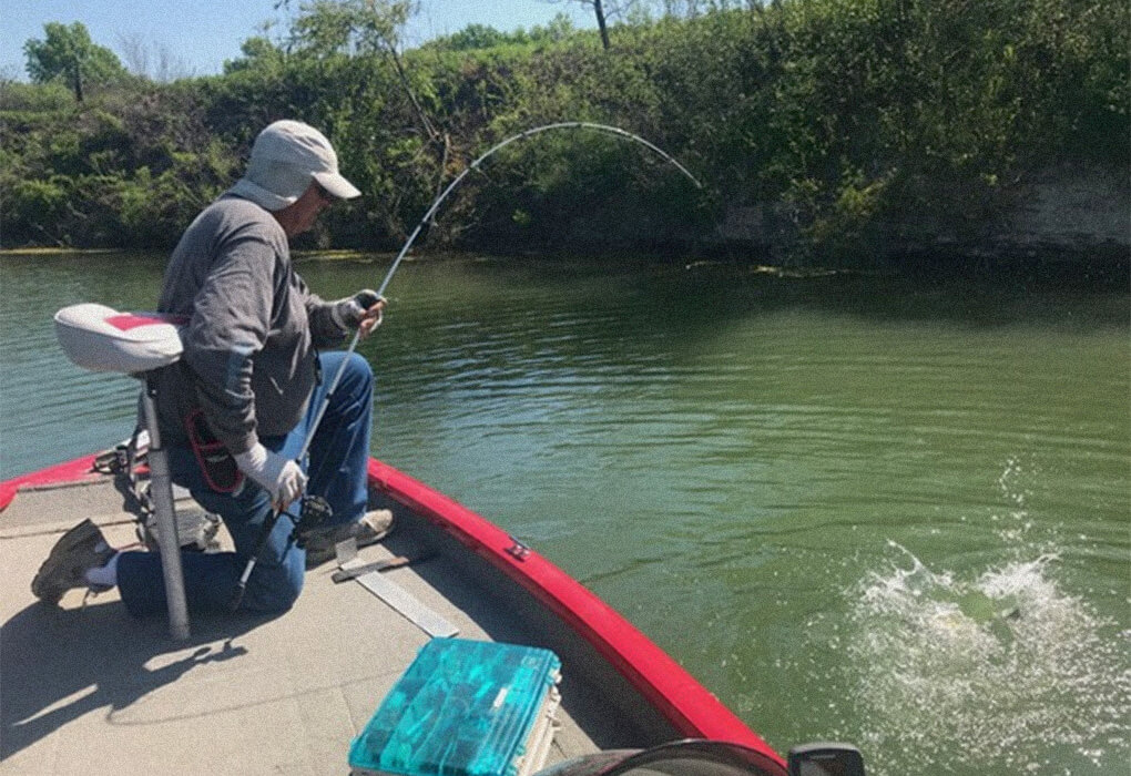 fisherman out on water fishing