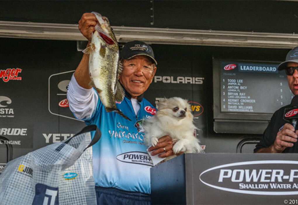 Gary Yamamoto posed with his fishing partner, one of his long-haired chihuahuas, during weigh-ins at a FLW tournament in 2017. (Photo by Charles Waldorf/FLW)