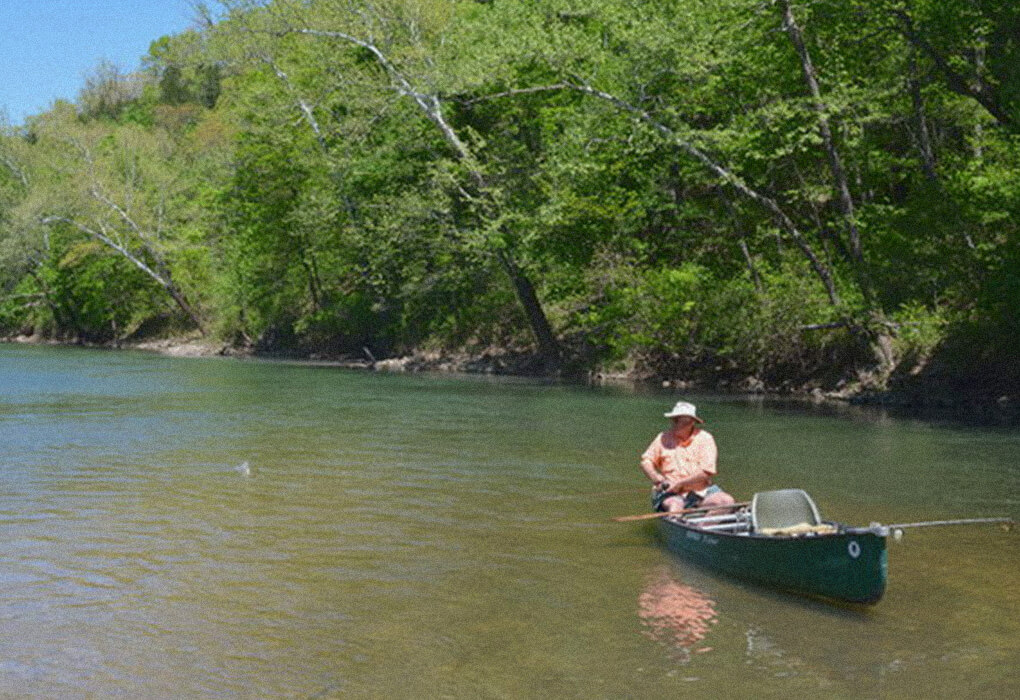 Guide Dennis Whiteside fished an Ozarks stream on a hot summer day. (Photo by Brent Frazee)