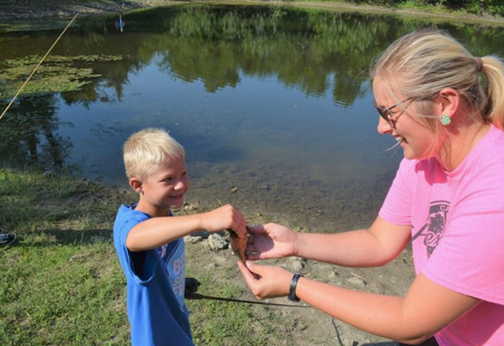 Smiles are common when kids get to go fishing. (Photo by Brent Frazee)