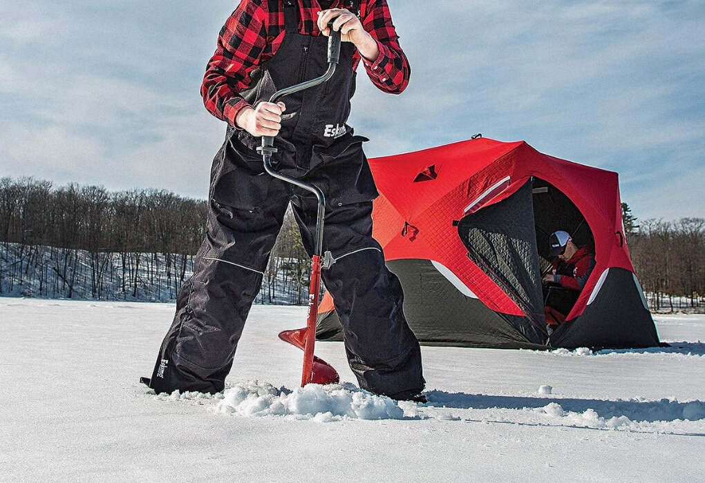 ma drilling in ice with an ice hand auger